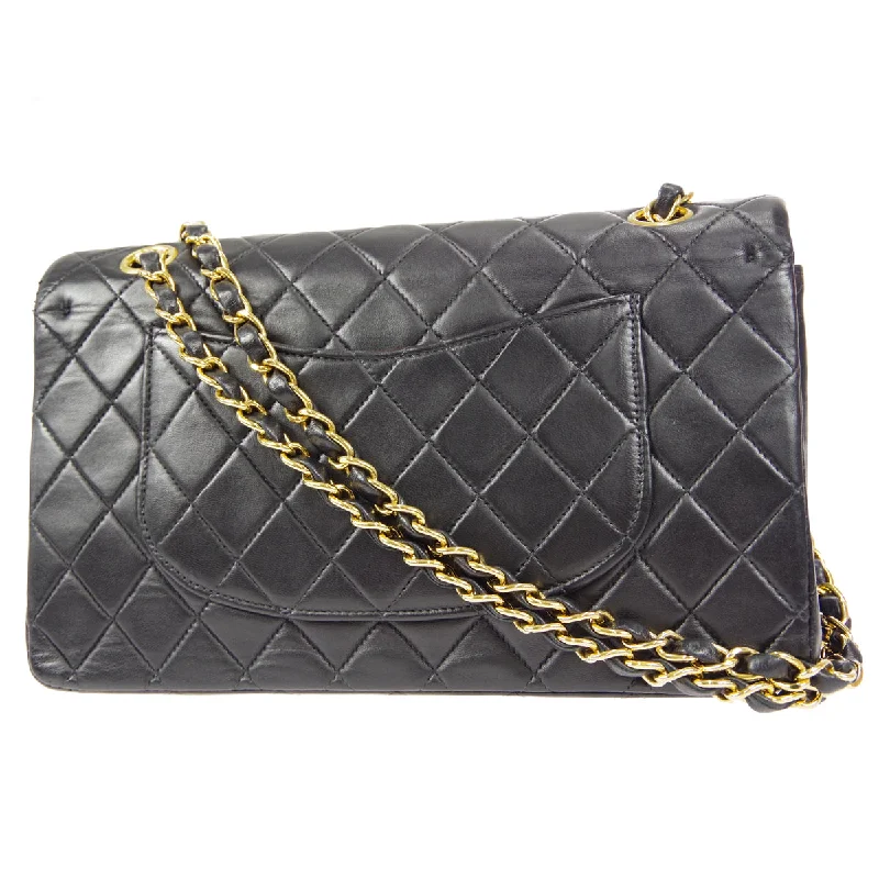 CHANEL bags with bold and elegant accents -CHANEL 2000-2001 Classic Double Flap Medium Black Lambskin