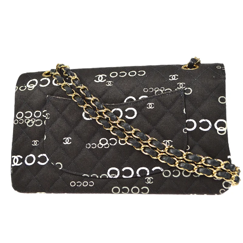 CHANEL handbags with timeless craftsmanship -CHANEL 2001-2003 COCO patterned Classic Double Flap Medium Black Canvas